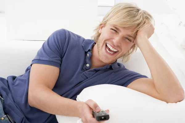 Man Living Room Holding Remote Control Laughing — Stock Photo, Image