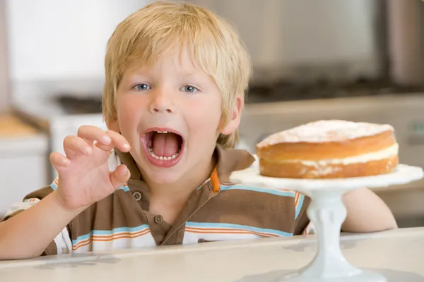 Boy Grabbing Cake Home — Stock Photo, Image