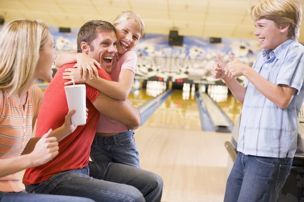 Family Bowling Alley Cheering Smiling Stock Photo