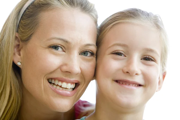Woman and young girl smiling Stock Picture