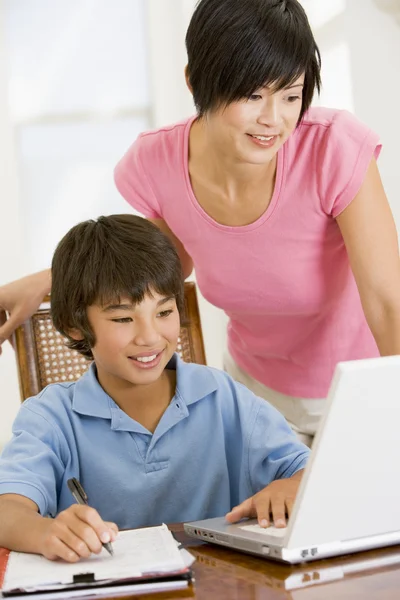 Woman Helping Young Boy Laptop Homework Dining Room — Stok fotoğraf