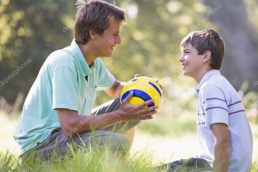 http://static5.depositphotos.com/1037987/476/i/950/depositphotos_4767982-Man-and-young-boy-outdoors-with-soccer-ball-smiling.jpg