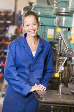 Machinist working on machine clipart