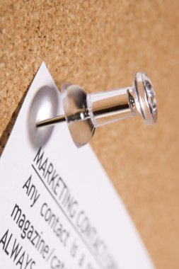 Close Up Of Thumbtack In Bulletin Board clipart