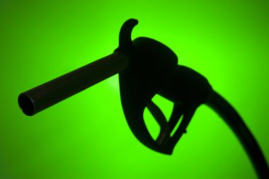 Fuel Pump Silhouette Against A Green Background clipart