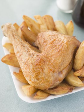 Portion Of Chicken And Chips On A Polystyrene Tray clipart