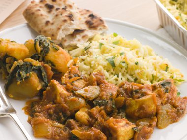 Chicken Bhoona, Sag Aloo, Pilau Rice And Naan Bread clipart