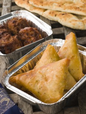 Indian Take Away- Vegetable Samosa, Naan Bread And Onion Bahji clipart