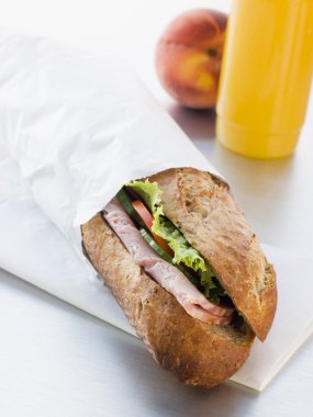 Ham And Salad Granary Baguette With Mango And Banana Smoothie An clipart