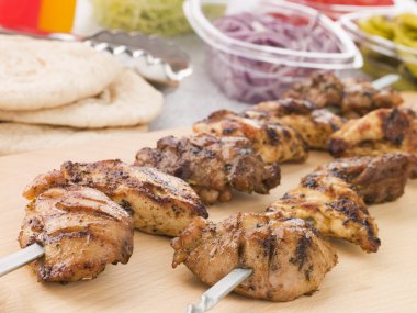 Marinated Chicken Kebab On A Skewer clipart
