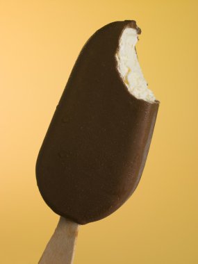 Close Up Of A Chocolate Coated Ice Block clipart