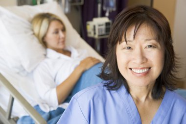 Doctor Standing In Patients Room,Smiling clipart