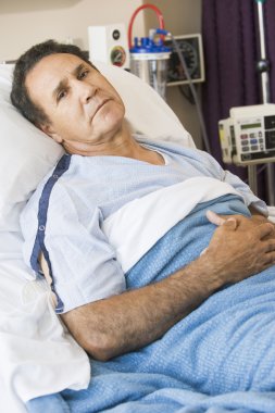 Man Lying In Hospital Bed clipart