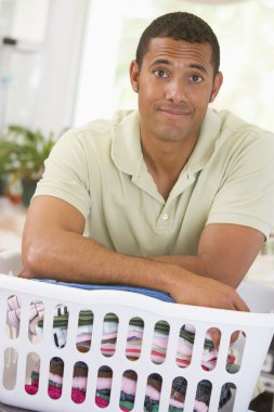 Man Leaning On Laundry clipart