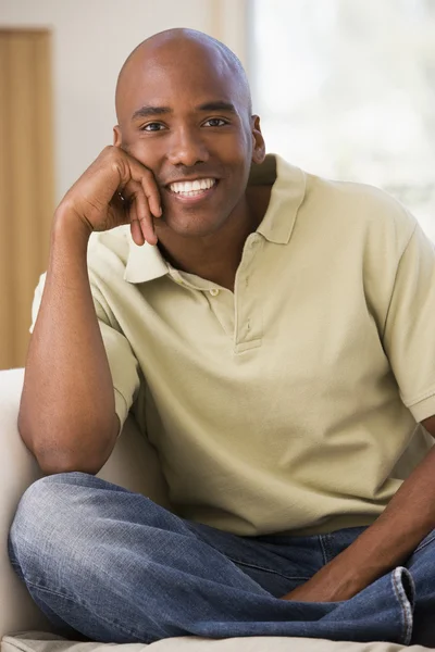 Man Sitting Living Room Smiling — Stock Photo, Image