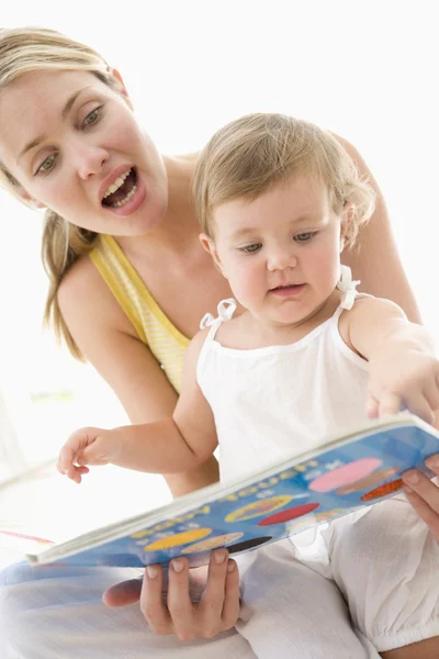 Mother Baby Reading Book Indoors Pointing — Stock Photo, Image