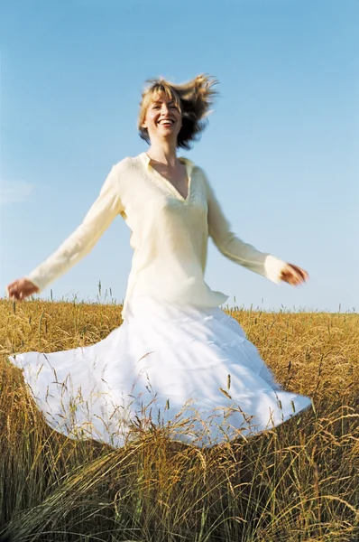 Woman Spinning Outdoors Smiling — Stock Photo, Image