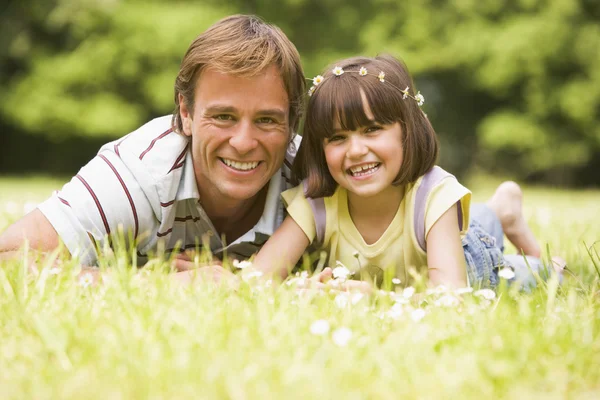 Father Daughter Lying Outdoors Flowers Smiling — Stockfoto