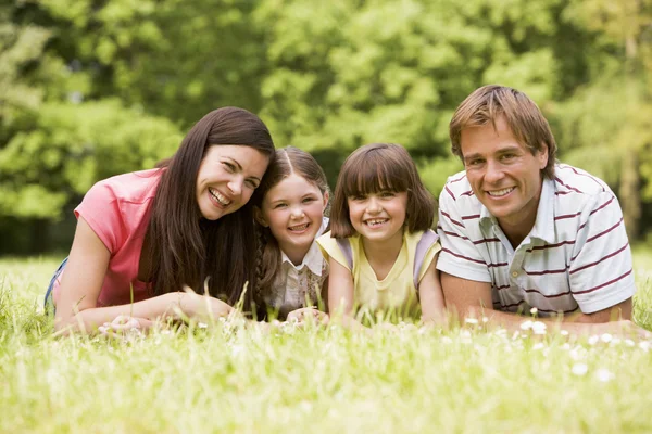 Family outdoors smiling — Stock Photo, Image