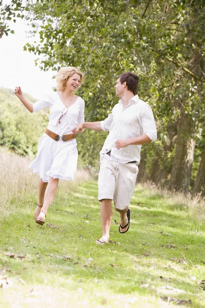 Couple Running Path Holding Hands Smiling — Stock Photo, Image