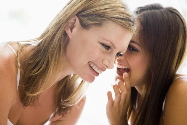 Two Women Whispering Smiling — Stock Photo, Image
