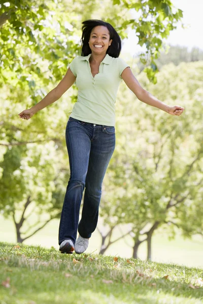 Woman Running Outdoors Smiling — Stock Photo, Image