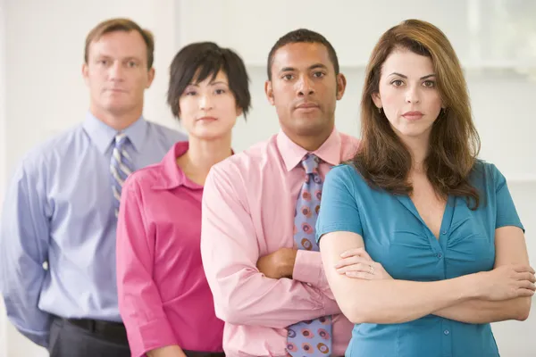 Business team standing indoors — Stock Photo, Image