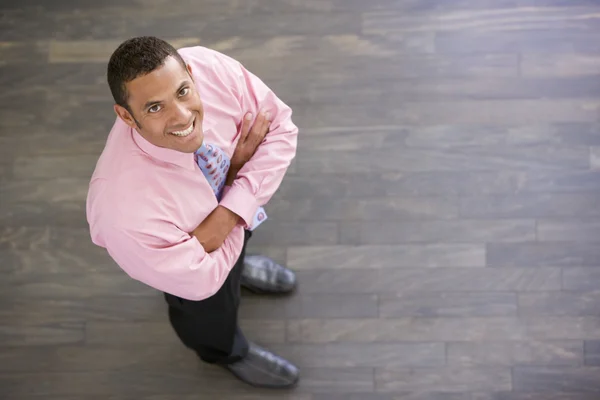 Businessman Standing Indoors Smiling — Stock Photo, Image