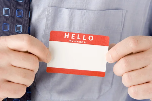 Close Up Of Businessman Attaching Name Tag — Stock Photo, Image