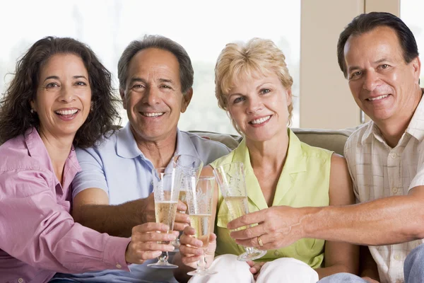 Two Couples Living Room Drinking Champagne Smiling — Stock Photo, Image