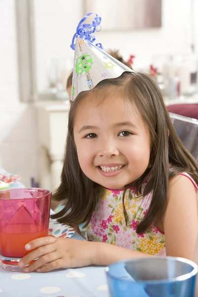 Young Girl Wearing Party Hat Table Smiling — Stock Photo, Image