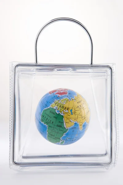 Глобус в пластиковом мешке — стоковое фото