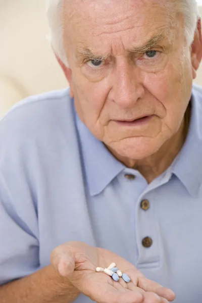 Senior Man Holding Prescription Drugs — Stock Photo, Image