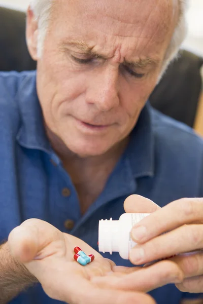 Senior Man Pouring Pills Out Of Bottle — Stock Photo, Image