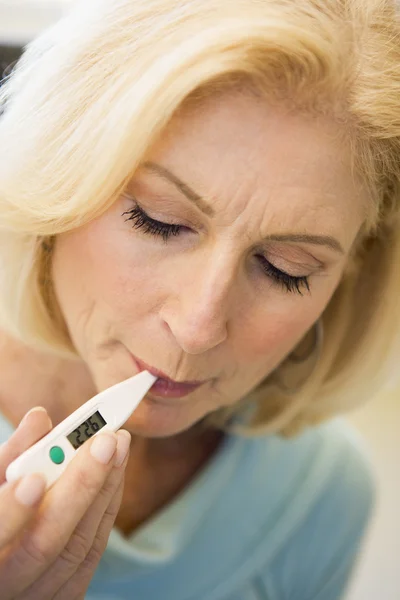 Woman Taking Her Temperature Thermometer — Stock Photo, Image