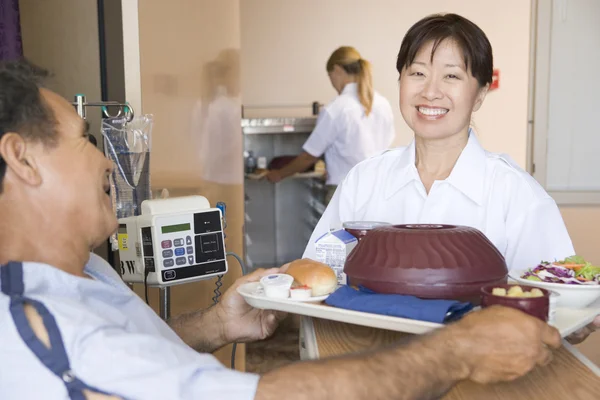 Nurse Serving A Patient A Meal In His Bed — Stock Photo, Image