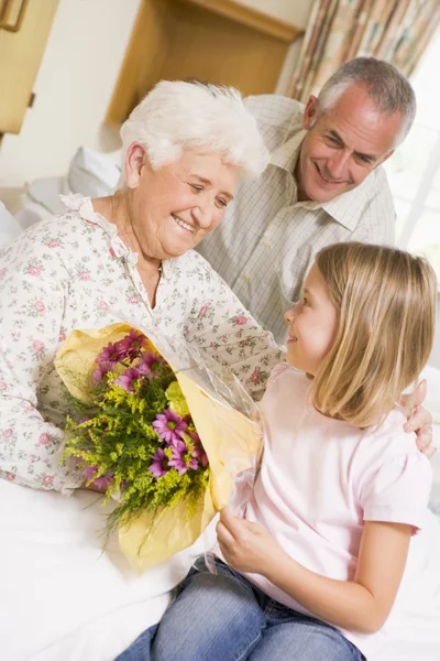 Granddaughter Giving Flowers Her Grandmother Hospital — Stock Photo, Image
