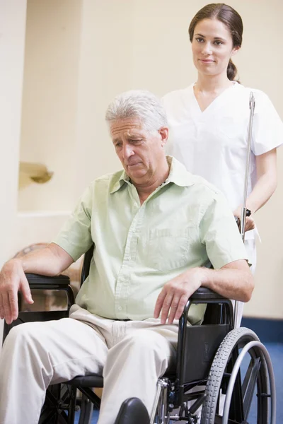 Nurse Pushing Man In Wheelchair — Stock Photo, Image