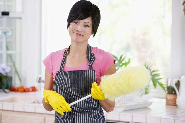 Woman Holding Duster Wearing Rubber Gloves — Stock Photo, Image