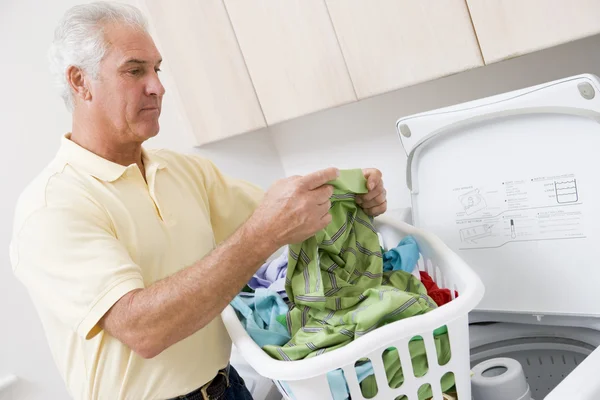 Man Reading Washing Instructions — Stock Photo, Image