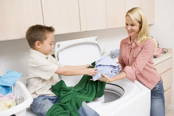 Mother Son Doing Laundry — стоковое фото