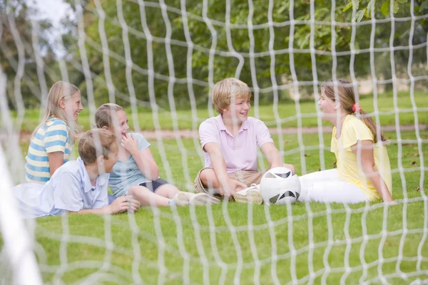 Five Young Friends Soccer Field Talking Smiling — Stok fotoğraf