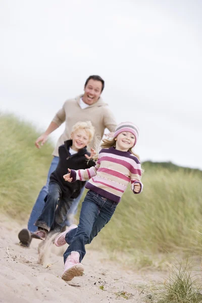 Father Two Young Children Running Beach Smiling Stock Photo