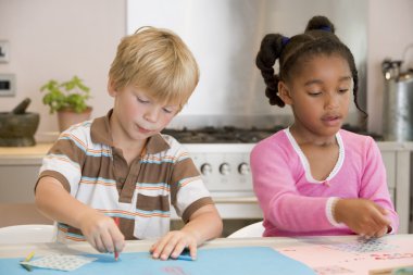 Two Young Friends Drawing Pictures clipart