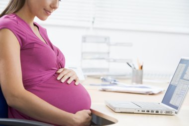 Pregnant woman at work clipart