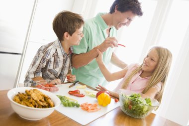Father And Children Prepare A meal,mealtime Together clipart