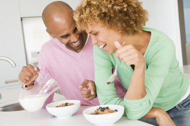 Husband And Wife Eating Breakfast Together clipart