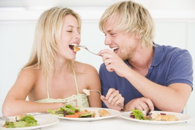Young Couple Enjoying meal,mealtime Together clipart