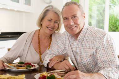 Elderly Couple Enjoying meal,mealtime Together clipart