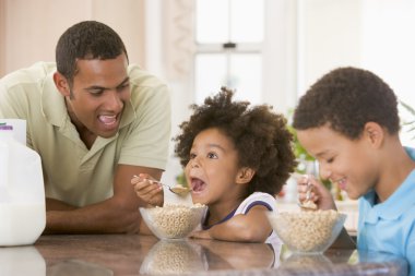 Children Eating Breakfast With Dad clipart
